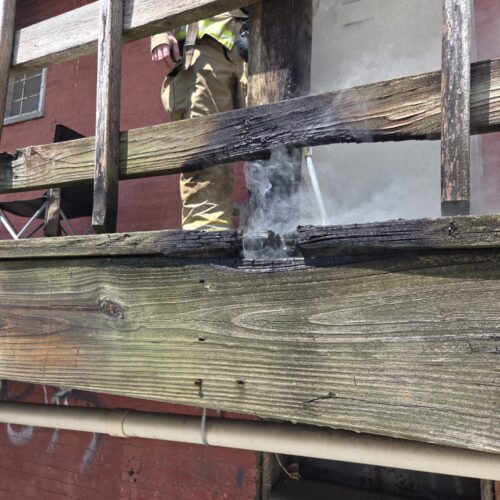 Downtown porch fire quickly contained