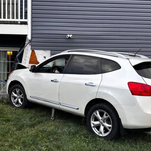 Vehicle strikes building on Orchard Drive